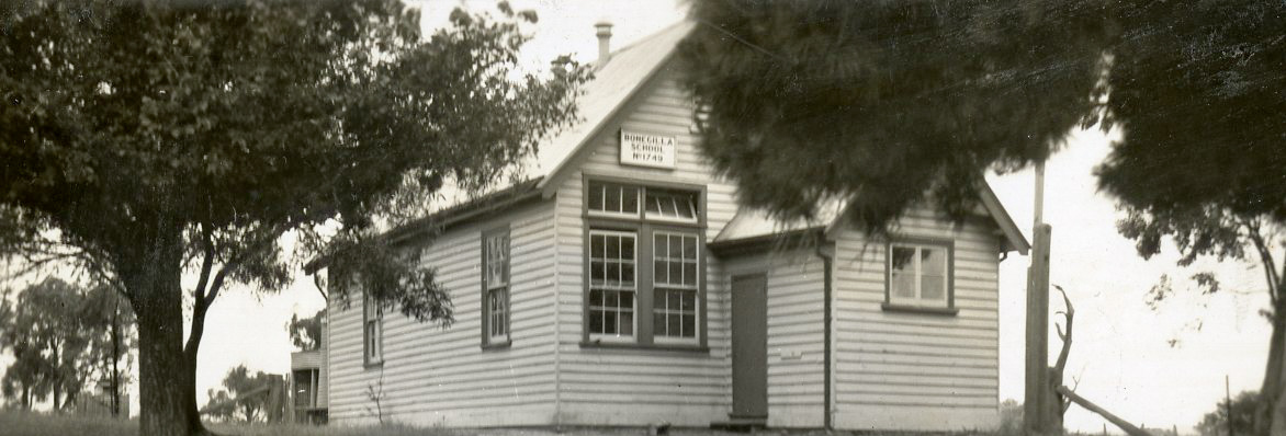 Black and white photo of an old school building
